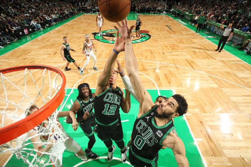 BOSTON, MA - FEBRUARY 3: Jayson Tatum #0 of the Boston Celtics rebounds the ball during the game against the Phoenix Suns on February 3, 2023 at TD Garden in Boston, Massachusetts.  NOTE TO USER: User expressly acknowledges and agrees that, by downloading and or using this photograph, User is consenting to the terms and conditions of the Getty Images License Agreement. Mandatory Copyright Notice: Copyright 2022 NBAE  (Photo by Nathaniel S. Butler/NBAE via Getty Images)