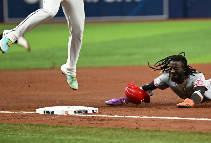 Jul 28, 2024; St. Petersburg, Florida, USA;  Cincinnati Reds short stop Elly De La Cruz (44) steals third base in the sixth  inning against the Tampa Bay Rays  at Tropicana Field. Mandatory Credit: Jonathan Dyer-USA TODAY Sports