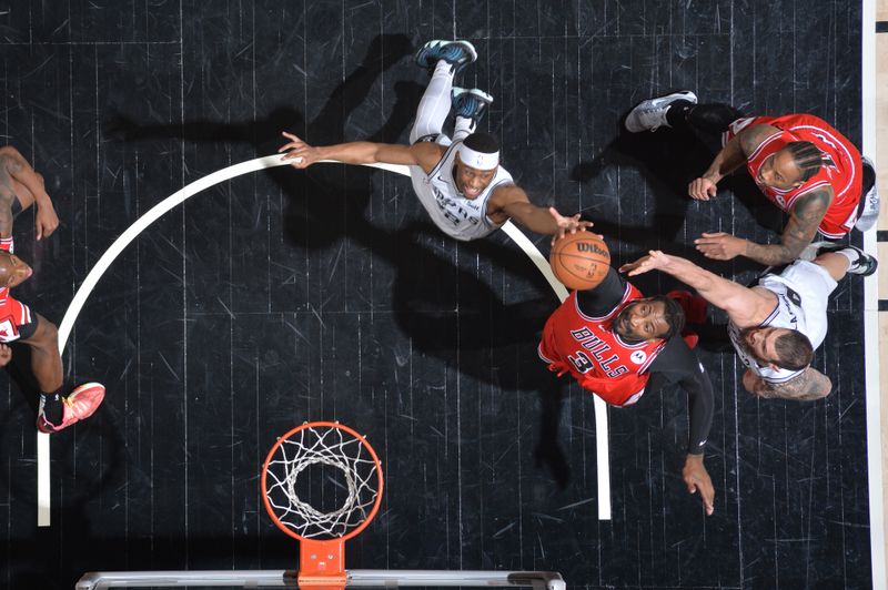 SAN ANTONIO, TX - JANUARY 13: Malaki Branham #22 of the San Antonio Spurs and Andre Drummond #3 of the Chicago Bulls go up for the rebound during the game on January 13, 2024 at the Frost Bank Center in San Antonio, Texas. NOTE TO USER: User expressly acknowledges and agrees that, by downloading and or using this photograph, user is consenting to the terms and conditions of the Getty Images License Agreement. Mandatory Copyright Notice: Copyright 2024 NBAE (Photos by Michael Gonzales/NBAE via Getty Images)