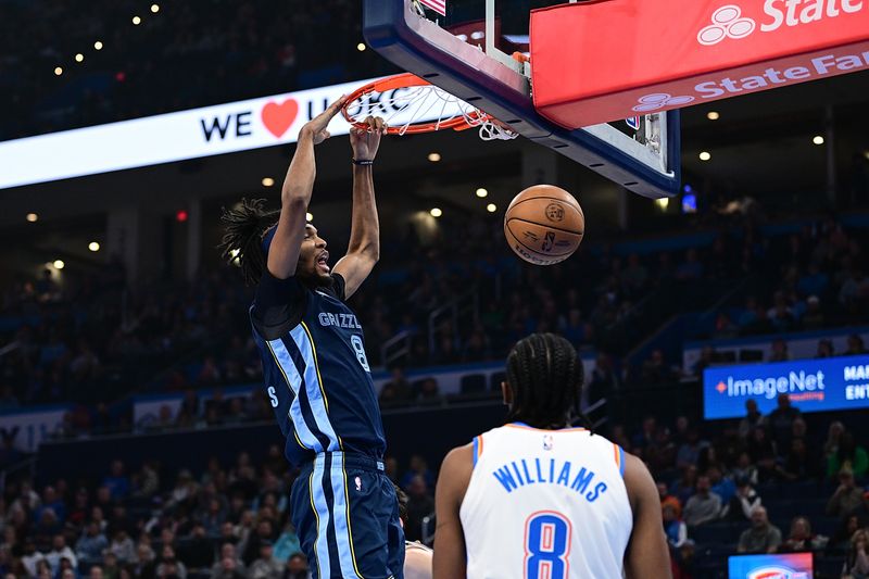 OKLAHOMA CITY, OKLAHOMA - DECEMBER 18: Ziaire Williams #8 of the Memphis Grizzlies finishes a dunk during the first half against the Oklahoma City Thunder at Paycom Center on December 18, 2023 in Oklahoma City, Oklahoma. NOTE TO USER: User expressly acknowledges and agrees that, by downloading and or using this Photograph, user is consenting to the terms and conditions of the Getty Images License Agreement. (Photo by Joshua Gateley/Getty Images)