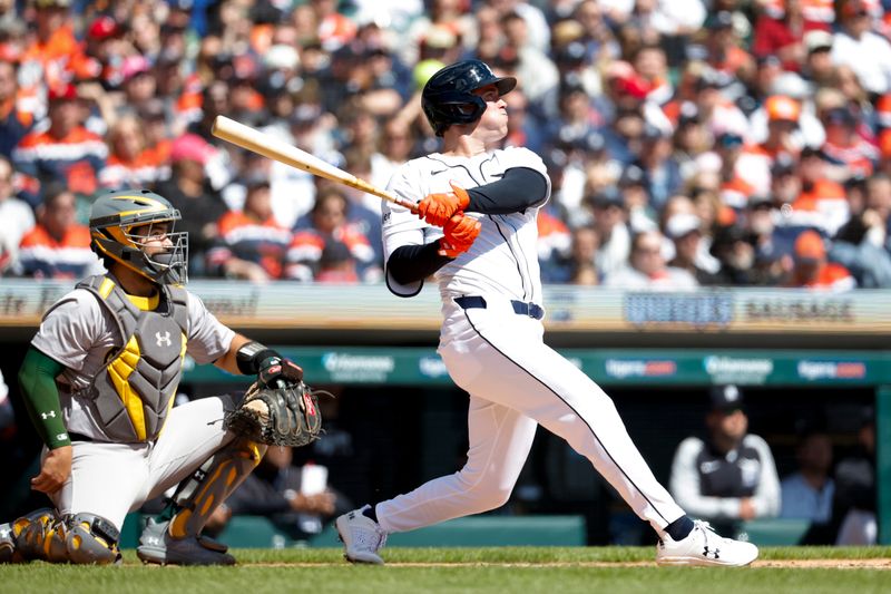 Apr 6, 2024; Detroit, Michigan, USA;  Detroit Tigers right fielder Kerry Carpenter (30) hits a double against the Oakland Athletics in the first inning at Comerica Park. Mandatory Credit: Rick Osentoski-USA TODAY Sports