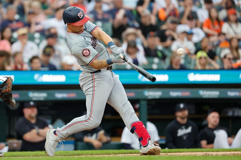 Jun 12, 2024; Detroit, Michigan, USA;  Washington Nationals third baseman Nick Senzel (13) hits a single in the sixth inning against the Detroit Tigers at Comerica Park. Mandatory Credit: Rick Osentoski-USA TODAY Sports