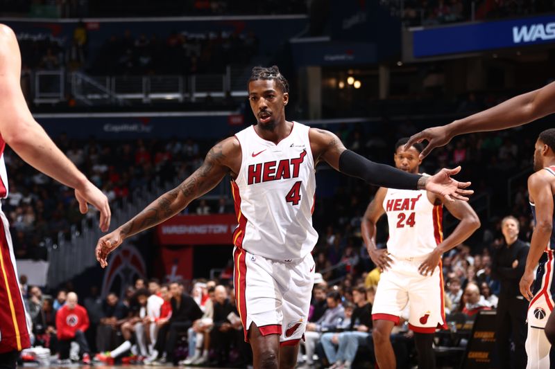 WASHINGTON, DC -? MARCH 31: Delon Wright #4 of the Miami Heat high fives teammates during the game against the Washington Wizards on March 31, 2024 at Capital One Arena in Washington, DC. NOTE TO USER: User expressly acknowledges and agrees that, by downloading and or using this Photograph, user is consenting to the terms and conditions of the Getty Images License Agreement. Mandatory Copyright Notice: Copyright 2024 NBAE (Photo by Kenny Giarla/NBAE via Getty Images)