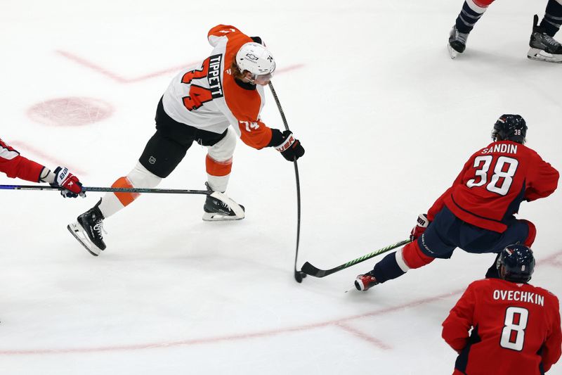 Mar 20, 2025; Washington, District of Columbia, USA; Philadelphia Flyers right wing Owen Tippett (74) takes a shot past Washington Capitals defenseman Rasmus Sandin (38) during the third period at Capital One Arena. Mandatory Credit: Daniel Kucin Jr.-Imagn Images