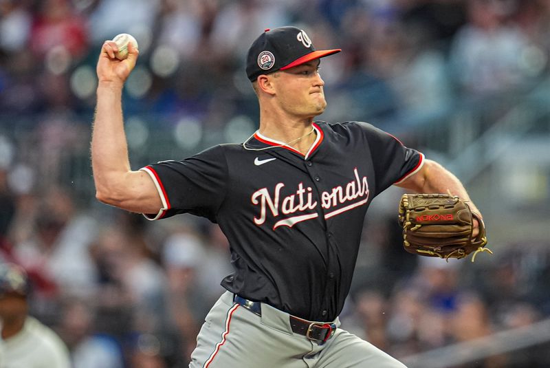 Sep 23, 2025; Cumberland, Georgia, USA; Washington Nationals starting pitcher Brad Lord (61) pitches against the Atlanta Braves during the first inning at Truist Park. Mandatory Credit: Dale Zanine-Imagn Images