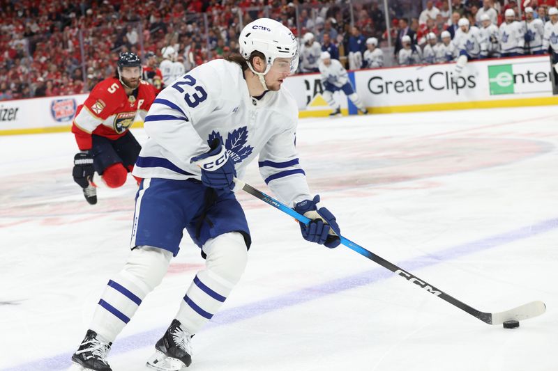 May 11, 2025; Sunrise, Florida, USA; Toronto Maple Leafs left wing Matthew Knies (23) skates with the puck against the Florida Panthers during the first period in game four of the second round of the 2025 Stanley Cup Playoffs at Amerant Bank Arena. Mandatory Credit: Kim Klement Neitzel-Imagn Images