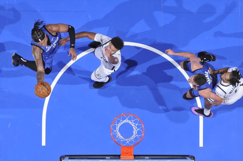 ORLANDO, FL - OCTOBER 25: Paolo Banchero #5 of the Orlando Magic drives to the basket during the game against the Brooklyn Nets on October 25, 2024 at Kia Center in Orlando, Florida. NOTE TO USER: User expressly acknowledges and agrees that, by downloading and or using this photograph, User is consenting to the terms and conditions of the Getty Images License Agreement. Mandatory Copyright Notice: Copyright 2024 NBAE (Photo by Fernando Medina/NBAE via Getty Images)