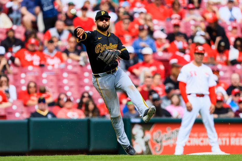 Apr 13, 2025; Cincinnati, Ohio, USA; Pittsburgh Pirates third baseman Isiah Kiner-Falefa (7) throws to first to get Cincinnati Reds first baseman Jeimer Candelario (not pictured) out in the eighth inning at Great American Ball Park. Mandatory Credit: Katie Stratman-Imagn Images