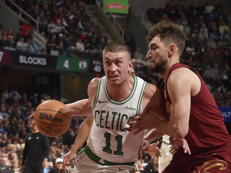 CLEVELAND, OH - DECEMBER 1: Payton Pritchard #11 of the Boston Celtics drives to the basket during the game against the Cleveland Cavaliers on December 1, 2024 at Rocket Mortgage FieldHouse in Cleveland, Ohio. NOTE TO USER: User expressly acknowledges and agrees that, by downloading and/or using this Photograph, user is consenting to the terms and conditions of the Getty Images License Agreement. Mandatory Copyright Notice: Copyright 2024 NBAE (Photo by David Liam Kyle/NBAE via Getty Images)