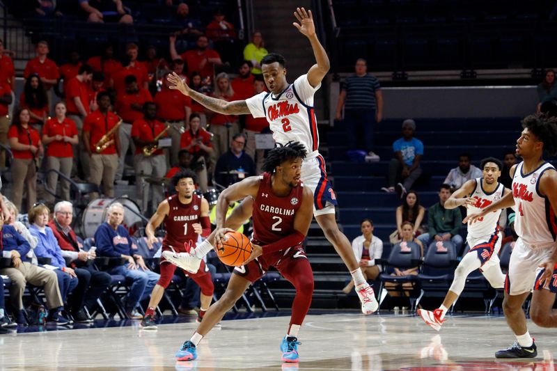 Feb 11, 2023; Oxford, Mississippi, USA; Mississippi Rebels guard TJ Caldwell (2) defends South Carolina Gamecocks guard Chico Carter Jr. (2) during the second half at The Sandy and John Black Pavilion at Ole Miss. Mandatory Credit: Petre Thomas-USA TODAY Sports