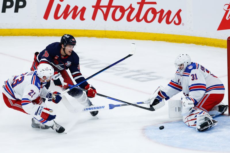 Mar 12, 2026; Winnipeg, Manitoba, CAN; Winnipeg Jets forward Morgan Barron (36) shoots on New York Rangers goalie Igor Shesterkin (31) despite a check by New York Rangers defenseman Adam Fox (23) during the second period at Canada Life Centre. Mandatory Credit: Terrence Lee-Imagn Images