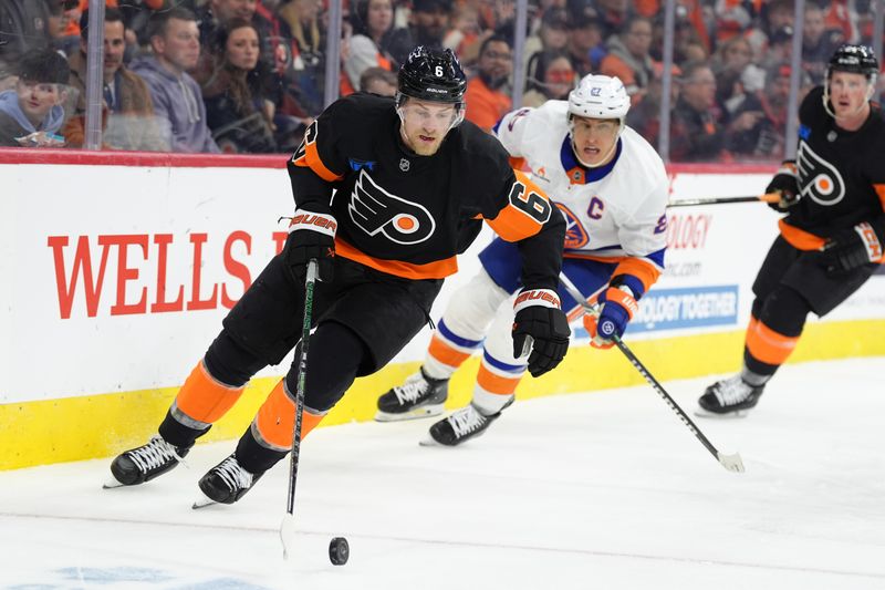 Apr 12, 2025; Philadelphia, Pennsylvania, USA; Philadelphia Flyers defenseman Travis Sanheim (6) chases the puck against the New York Islanders in the third period at Wells Fargo Center. Mandatory Credit: Kyle Ross-Imagn Images
