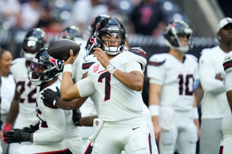 Houston Texans quarterback C.J. Stroud warms up before the start of an NFL football game between the Chicago Bears and Houston Texans Sunday, Sept. 15, 2024, in Houston. (AP Photo/Eric Christian Smith)