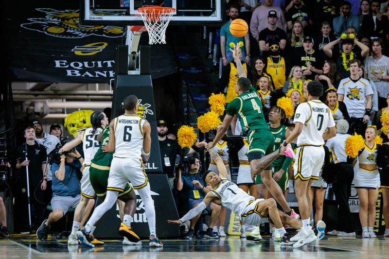 Feb 27, 2025; Wichita, Kansas, USA; UAB Blazers forward Christian Coleman (4) shoots the ball over Wichita State Shockers guard Xavier Bell (1) during the second half at Charles Koch Arena. Mandatory Credit: William Purnell-Imagn Images