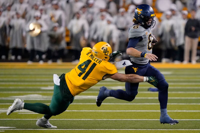 Nov 25, 2023; Waco, Texas, USA; West Virginia Mountaineers quarterback Garrett Greene (6) carries the ball as Baylor Bears linebacker Brooks Miller (41) defends during the second half at McLane Stadium. Mandatory Credit: Raymond Carlin III-USA TODAY Sports