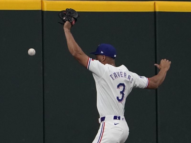 Aug 31, 2024; Arlington, Texas, USA; Texas Rangers center fielder Leody Taveras (3) cannot make the catch during the sixth inning against the Oakland Athletics at Globe Life Field. Mandatory Credit: Raymond Carlin III-USA TODAY Sports