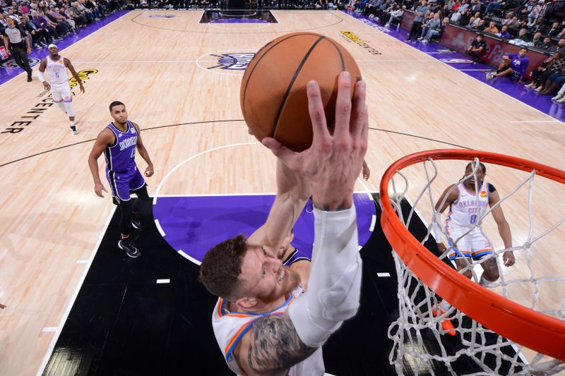 SACRAMENTO, CA - NOVEMBER 25:  Isaiah Hartenstein #55 of the Oklahoma City Thunder dunks the ball during the game against the Sacramento Kings on November 25, 2024 at Golden 1 Center in Sacramento, California. NOTE TO USER: User expressly acknowledges and agrees that, by downloading and or using this Photograph, user is consenting to the terms and conditions of the Getty Images License Agreement. Mandatory Copyright Notice: Copyright 2024 NBAE (Photo by Rocky Widner/NBAE via Getty Images)