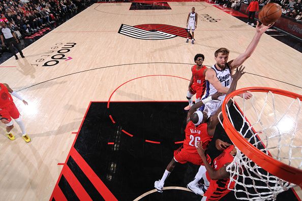 PORTLAND, OR - DECEMBER 26: Domantas Sabonis #10 of the Sacramento Kings drives to the basket during the game against the Portland Trail Blazers on December 26, 2023 at the Moda Center Arena in Portland, Oregon. NOTE TO USER: User expressly acknowledges and agrees that, by downloading and or using this photograph, user is consenting to the terms and conditions of the Getty Images License Agreement. Mandatory Copyright Notice: Copyright 2023 NBAE (Photo by Cameron Browne/NBAE via Getty Images)