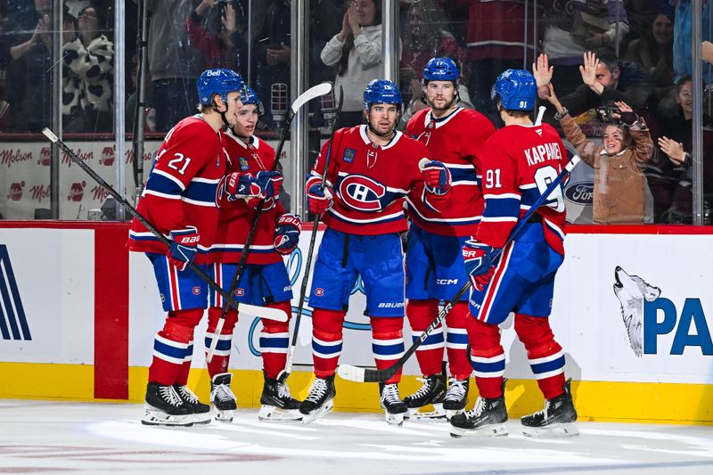 Oct 12, 2024; Montreal, Quebec, CAN; Montreal Canadiens center Alex Newhook (15) celebrates with defenseman Kaiden Guhle (21), defenseman Lane Hutson (48), right wing Josh Anderson (17) and center Oliver Kapanen (91) after scoring a goal against the Ottawa Senators during the third period at Bell Centre. Mandatory Credit: David Kirouac-Imagn Images