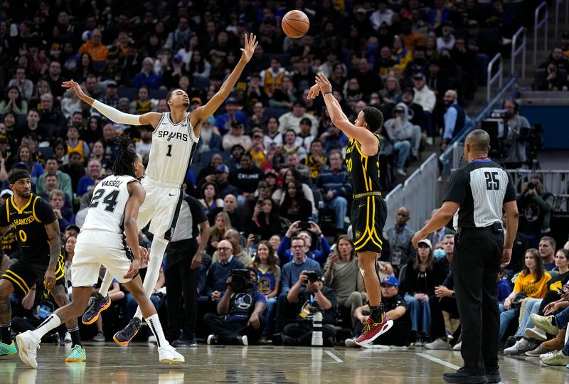 SAN FRANCISCO, CALIFORNIA - NOVEMBER 24: Stephen Curry #30 of the Golden State Warriors shoots a three-point shot over Victor Wembanyama #1 of the San Antonio Spurs during the fourth quarter of an NBA In-Season Tournament game at Chase Center on November 24, 2023 in San Francisco, California. NOTE TO USER: User expressly acknowledges and agrees that, by downloading and or using this photograph, User is consenting to the terms and conditions of the Getty Images License Agreement. (Photo by Thearon W. Henderson/Getty Images)