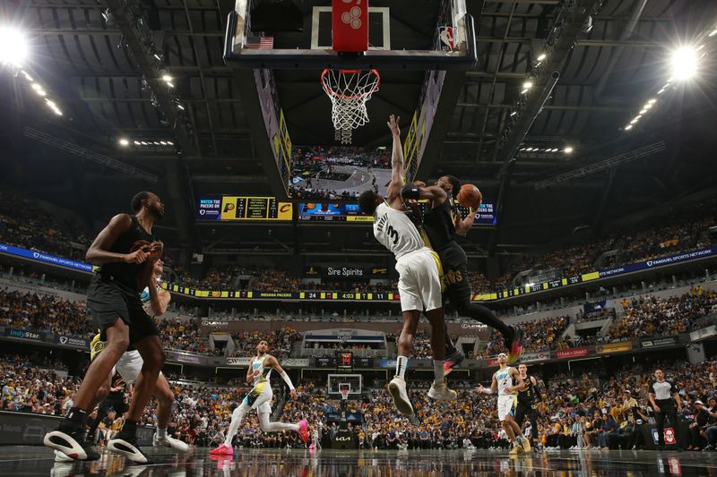 INDIANAPOLIS, IN - MAY 11:  Donovan Mitchell #45 of the Cleveland Cavaliers drives to the basket during the game against the Indiana Pacers  during Round 2 Game 3 of the 2025 NBA Playoffs  on May 11, 2025 at Gainbridge Fieldhouse in Indianapolis, Indiana. NOTE TO USER: User expressly acknowledges and agrees that, by downloading and or using this Photograph, user is consenting to the terms and conditions of the Getty Images License Agreement. Mandatory Copyright Notice: Copyright 2025 NBAE (Photo by Joe MurphyNBAE via Getty Images)