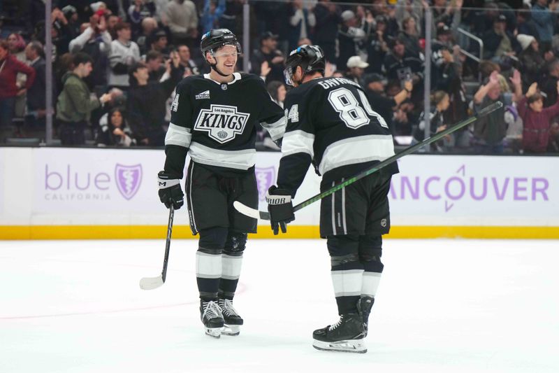 Nov 27, 2024; Los Angeles, California, USA; LA Kings defenseman Mikey Anderson (44) and defenseman Vladislav Gavrikov (84) celebrate after a goal against the Winnipeg Jets in the third period at Crypto.com Arena. Mandatory Credit: Kirby Lee-Imagn Images