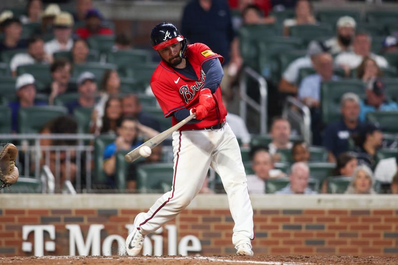 Jul 5, 2024; Atlanta, Georgia, USA; Atlanta Braves catcher Travis d'Arnaud (16) hits a single against the Philadelphia Phillies in the seventh inning at Truist Park. Mandatory Credit: Brett Davis-USA TODAY Sports
