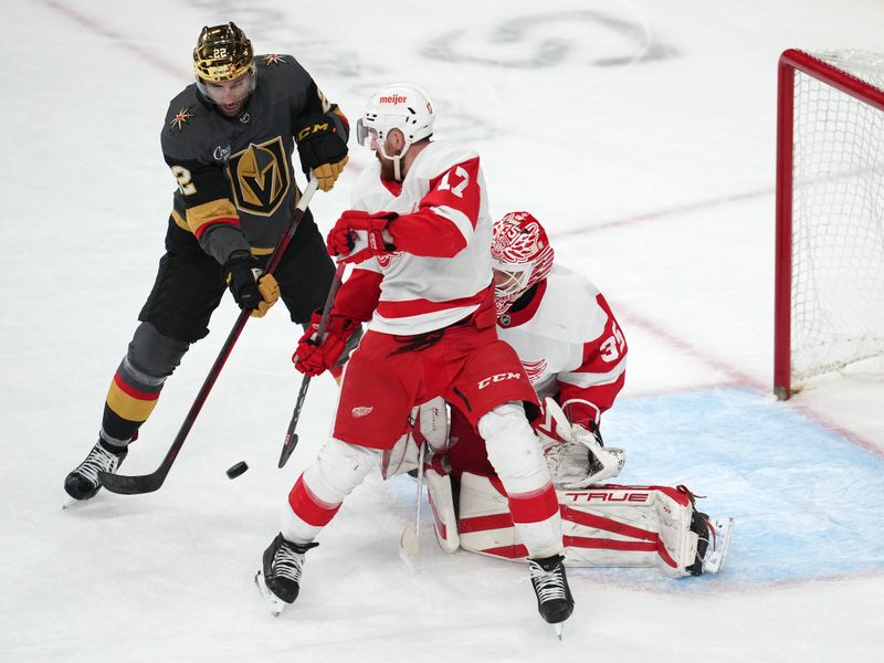 Jan 19, 2023; Las Vegas, Nevada, USA; Detroit Red Wings goaltender Ville Husso (35) prepares to make a save as Vegas Golden Knights right wing Michael Amadio (22) and Detroit Red Wings defenseman Filip Hronek (17) attempt to deflect the puck during the third period at T-Mobile Arena. Mandatory Credit: Stephen R. Sylvanie-USA TODAY Sports