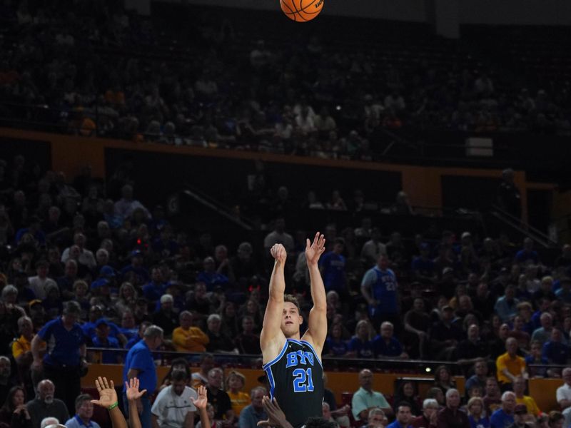 Feb 26, 2025; Tempe, Arizona, USA; Brigham Young Cougars guard Trevin Knell (21) shoots against the Arizona State Sun Devils at Desert Financial Arena. Mandatory Credit: Joe Camporeale-Imagn Images