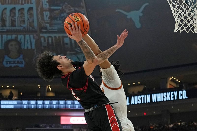 Jan 6, 2024; Austin, Texas, USA; Texas Tech Red Raiders guard Pop Isaacs (2) shoots during the second half against the Texas Longhorns at Moody Center. Mandatory Credit: Scott Wachter-USA TODAY Sports