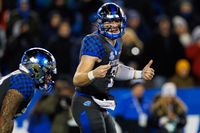 Wildcats Clash with Racers: A Battle for Dominance at Kroger Field