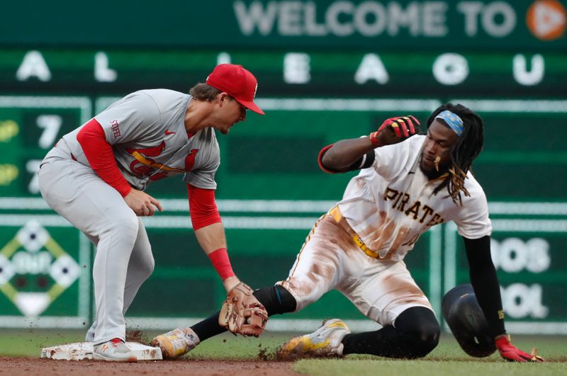 Jul 22, 2024; Pittsburgh, Pennsylvania, USA;  Pittsburgh Pirates shortstop Oneil Cruz (15) steals second base as St. Louis Cardinals second baseman Nolan Gorman (16) applies a late tag during the third inning at PNC Park. Mandatory Credit: Charles LeClaire-USA TODAY Sports