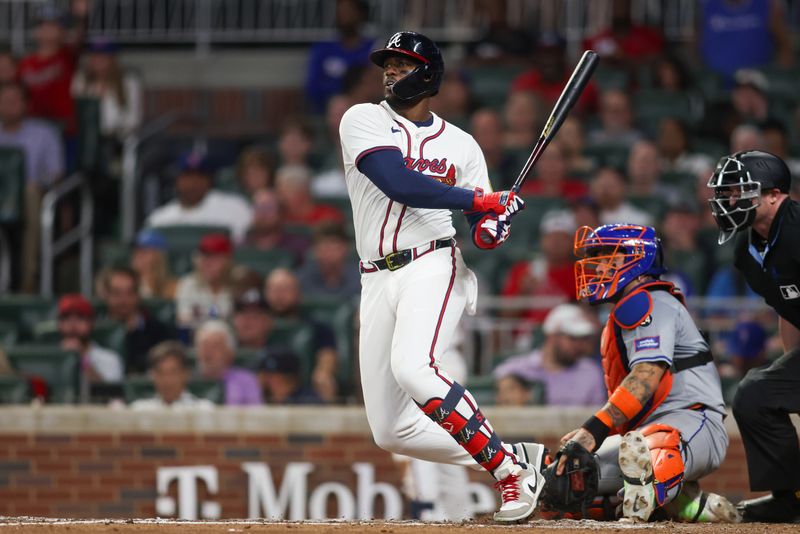 Sep 24, 2024; Atlanta, Georgia, USA; Atlanta Braves right fielder Jorge Soler (2) hits a single against the New York Mets in the fifth inning at Truist Park. Mandatory Credit: Brett Davis-Imagn Images
