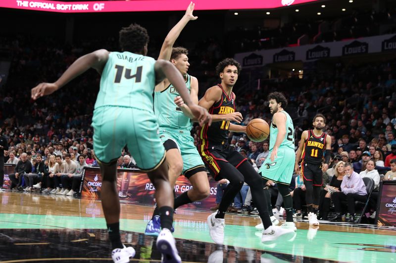 CHARLOTTE, NC - NOVEMBER 30: Zaccharie Risacher #10 of the Atlanta Hawks drives to the basket during the game against the Charlotte Hornets on November 30, 2024 at Spectrum Center in Charlotte, North Carolina. NOTE TO USER: User expressly acknowledges and agrees that, by downloading and or using this photograph, User is consenting to the terms and conditions of the Getty Images License Agreement. Mandatory Copyright Notice: Copyright 2024 NBAE (Photo by Brock Williams-Smith/NBAE via Getty Images)