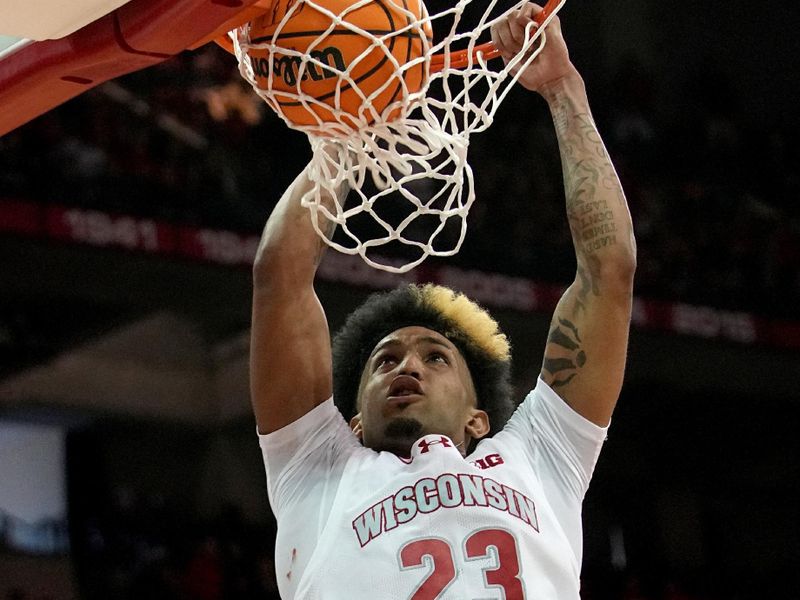 Feb 4, 2024; Madison, Wisconsin, USA; Wisconsin guard Chucky Hepburn (23) dunks the ball during the second half at Kohl Center. Mandatory Credit: Mark Hoffman-USA TODAY Sports
