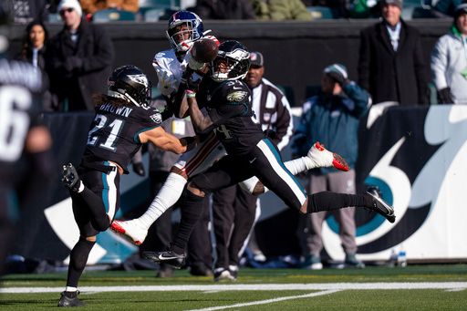 Philadelphia Eagles corner back Isaiah Rodgers (34) defensive the ball intended for New York Giants wide receiver Malik Nabers (1) during the NFL football game, Sunday, Jan. 5, 2025, in Philadelphia. (AP Photo/Chris Szagola)