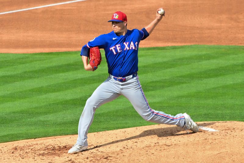 Feb 23, 2026; Tempe, Arizona, USA;  Texas Rangers pitcher Robert Garcia (62) throws in the fourth inning against the Los Angeles Angels during a spring training game at Tempe Diablo Stadium. Mandatory Credit: Matt Kartozian-Imagn Images