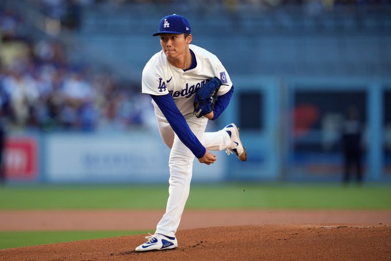 Jun 15, 2024; Los Angeles, California, USA; Los Angeles Dodgers starting pitcher Yoshinobu Yamamoto (18) throws in the first inning against the Kansas City Royals at Dodger Stadium. Mandatory Credit: Kirby Lee-USA TODAY Sports