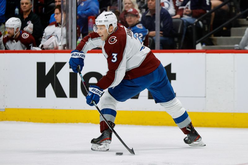 Feb 24, 2024; Denver, Colorado, USA; Colorado Avalanche defenseman Jack Johnson (3) controls the puck in the first period against the Toronto Maple Leafs at Ball Arena. Mandatory Credit: Isaiah J. Downing-USA TODAY Sports