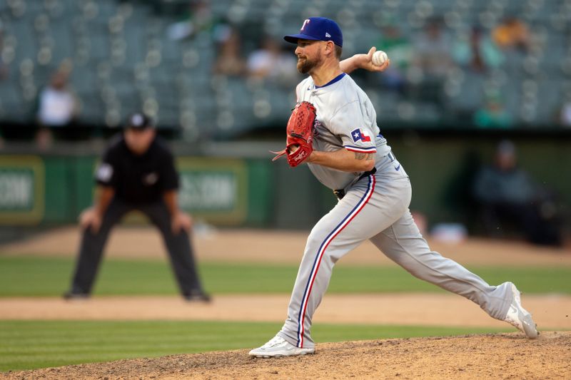 May 8, 2024; Oakland, California, USA; Texas Rangers pitcher Kirby Yates (39) delivers a pitch against the Oakland Athletics during the ninth inning at Oakland-Alameda County Coliseum. Mandatory Credit: D. Ross Cameron-USA TODAY Sports