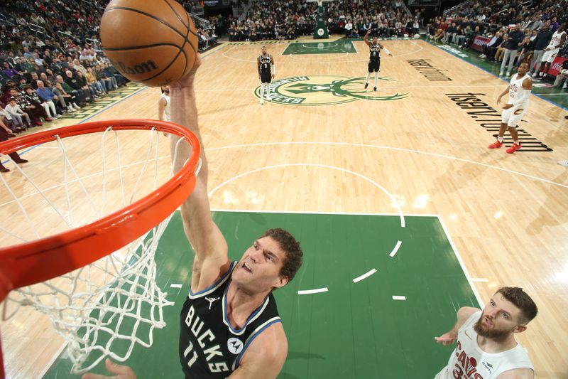 MILWAUKEE, WI - JANUARY 26: Brook Lopez #11 of the Milwaukee Bucks drives to the basket during the game  against the Cleveland Cavaliers  on January 26, 2024 at the Fiserv Forum Center in Milwaukee, Wisconsin. NOTE TO USER: User expressly acknowledges and agrees that, by downloading and or using this Photograph, user is consenting to the terms and conditions of the Getty Images License Agreement. Mandatory Copyright Notice: Copyright 2024 NBAE (Photo by Gary Dineen/NBAE via Getty Images).