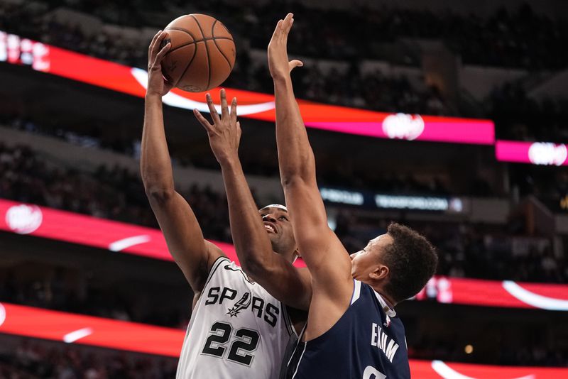 DALLAS, TEXAS - DECEMBER 23: Malaki Branham #22 of the San Antonio Spurs makes a move to the basket as Dante Exum #0 of the Dallas Mavericks defends during the first half at American Airlines Center on December 23, 2023 in Dallas, Texas. NOTE TO USER: User expressly acknowledges and agrees that, by downloading and or using this photograph, User is consenting to the terms and conditions of the Getty Images License Agreement. (Photo by Sam Hodde/Getty Images)