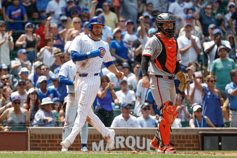 Jun 19, 2024; Chicago, Illinois, USA; Chicago Cubs first baseman Michael Busch (29) scores against the San Francisco Giants during the fourth inning at Wrigley Field. Mandatory Credit: Kamil Krzaczynski-USA TODAY Sports