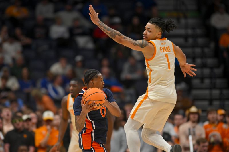 Mar 12, 2026; Nashville, TN, USA;  Auburn Tigers guard Tahaad Pettiford (0) fakes Tennessee Volunteers guard Amari Evans (1) during the first half at Bridgestone Arena. Mandatory Credit: Steve Roberts-Imagn Images