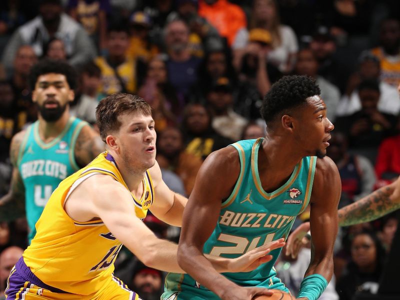 CHARLOTTE, NC - FEBRUARY 5: Austin Reaves #15 of the Los Angeles Lakers plays defense against Brandon Miller #24 of the Charlotte Hornets on February 5, 2024 at Spectrum Center in Charlotte, North Carolina. NOTE TO USER: User expressly acknowledges and agrees that, by downloading and or using this photograph, User is consenting to the terms and conditions of the Getty Images License Agreement. Mandatory Copyright Notice: Copyright 2024 NBAE (Photo by Kent Smith/NBAE via Getty Images)