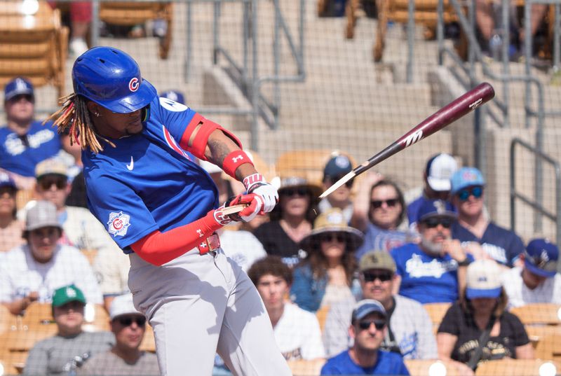 Feb 28, 2026; Phoenix, Arizona, USA; Chicago Cubs designated hitter Kevin Alcantara (13) reacts as his bat breaks during his at bat in the first inning of a spring training game against the Los Angeles Dodgers at Camelback Ranch-Glendale. Mandatory Credit: Allan Henry-Imagn Images