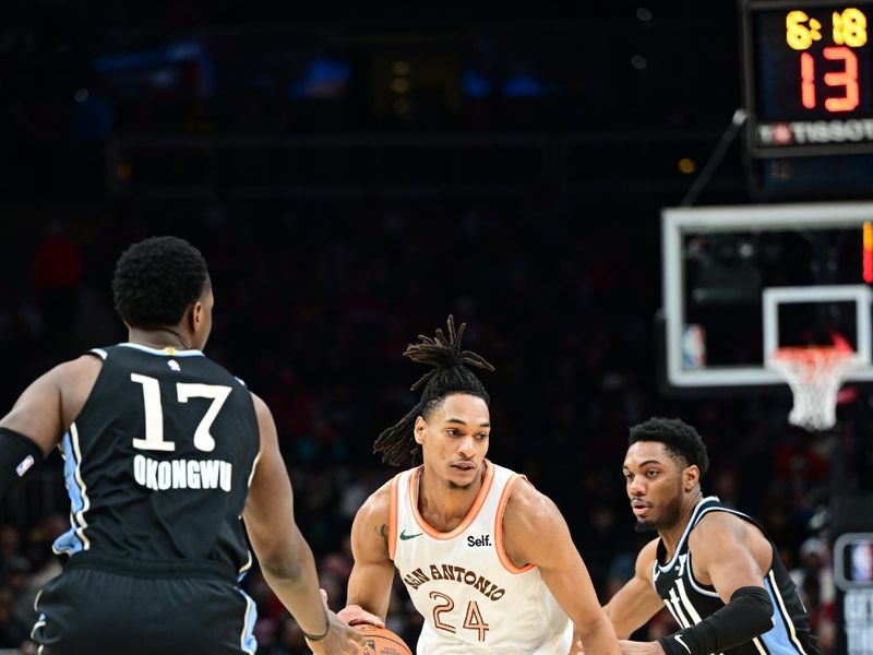 ATLANTA, GA - JANUARY 15: Devin Vassell #24 of the San Antonio Spurs handles the ball during the game against the Atlanta Hawks on January 15, 2024 at State Farm Arena in Atlanta, Georgia.  NOTE TO USER: User expressly acknowledges and agrees that, by downloading and/or using this Photograph, user is consenting to the terms and conditions of the Getty Images License Agreement. Mandatory Copyright Notice: Copyright 2024 NBAE (Photo by Adam Hagy/NBAE via Getty Images)