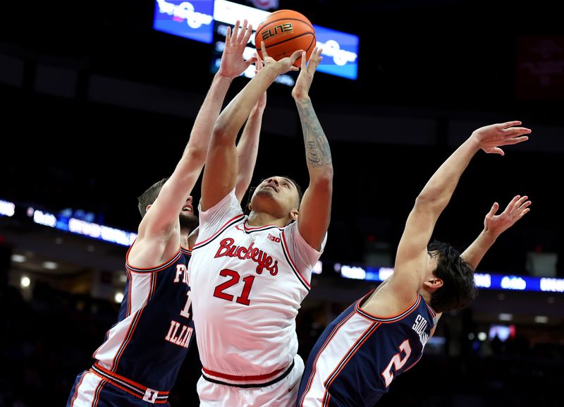 Dec 9, 2025; Columbus, Ohio, USA; Ohio State Buckeyes forward Devin Royal (21) goes to the basket as Illinois Fighting Illini center Tomislav Ivisic (13) and guard Andrej Stojakovic (2) defend during the second half at Value City Arena. Mandatory Credit: Joseph Maiorana-Imagn Images