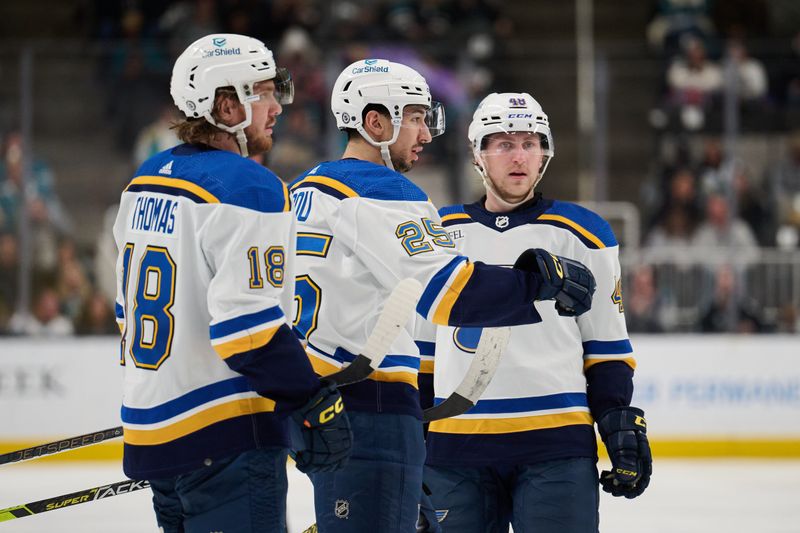 Apr 6, 2024; San Jose, California, USA; St. Louis Blues center Jordan Kyrou (25) celebrates with center Robert Thomas (18) and defenseman Scott Perunovich (48) after scoring a goal against the San Jose Sharks during the third period at SAP Center at San Jose. Mandatory Credit: Robert Edwards-USA TODAY Sports