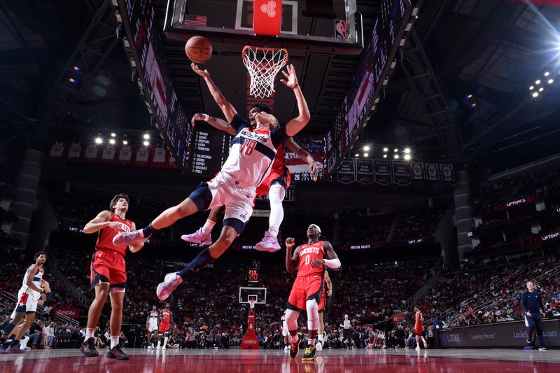 HOUSTON, TX - NOVEMBER 11: Kyshawn George #18 of the Washington Wizards drives to the basket during the game against the Houston Rockets on November 11, 2024 at the Toyota Center in Houston, Texas. NOTE TO USER: User expressly acknowledges and agrees that, by downloading and or using this photograph, User is consenting to the terms and conditions of the Getty Images License Agreement. Mandatory Copyright Notice: Copyright 2024 NBAE (Photo by Logan Riely/NBAE via Getty Images)